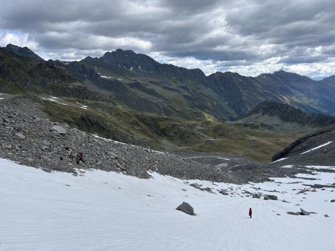 snowfield descent cloudy peaks