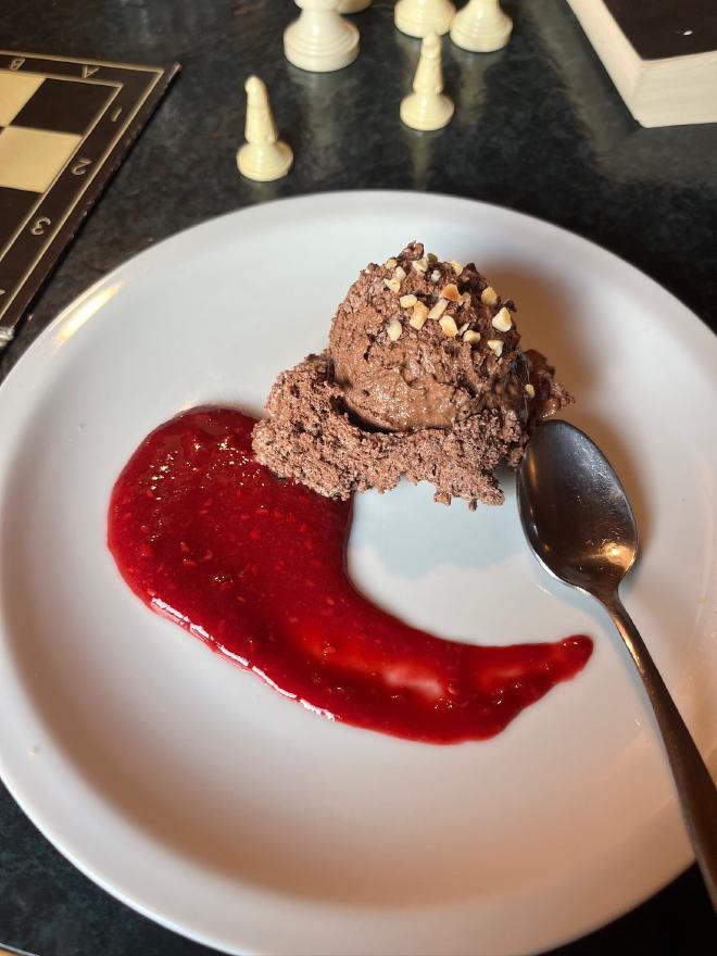 Chocolate mousse with raspberry coulis for dessert